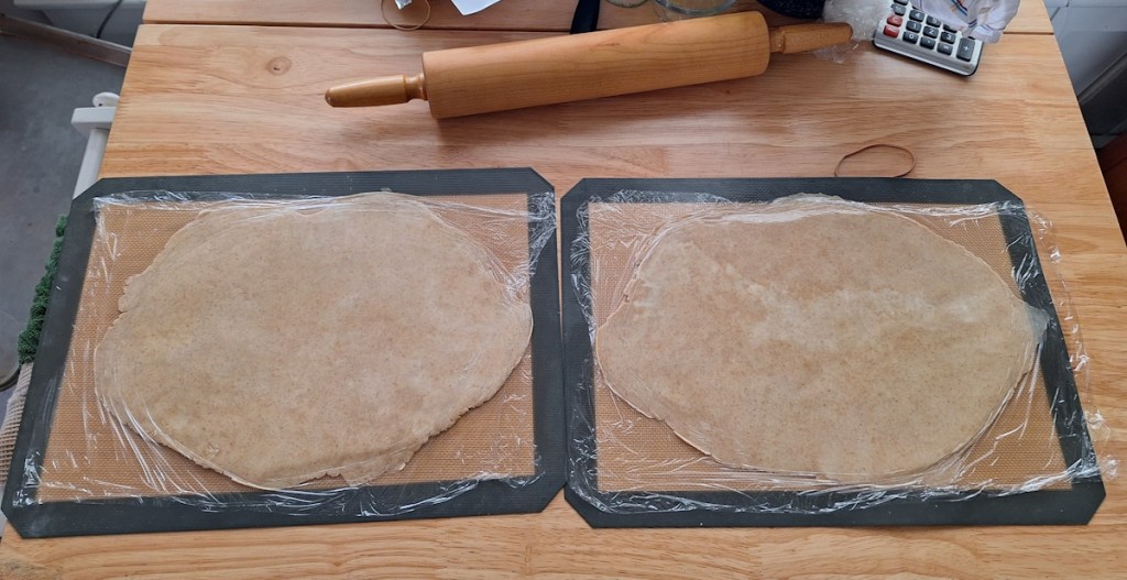 image of the dough rolled out on the silcone mats.